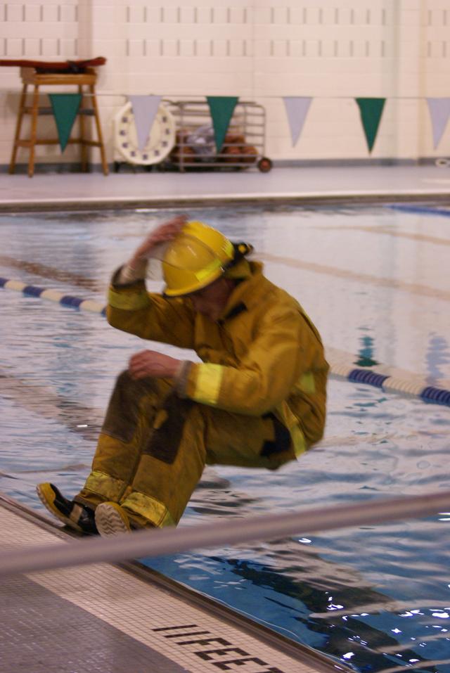 Firefighter Erik Stender &quot;falling&quot; into 11 feet of water with full turn out gear Lifeguard Systems &quot;Drown Proofing Firefighter Turn Out Gear&quot; 1/6/2012